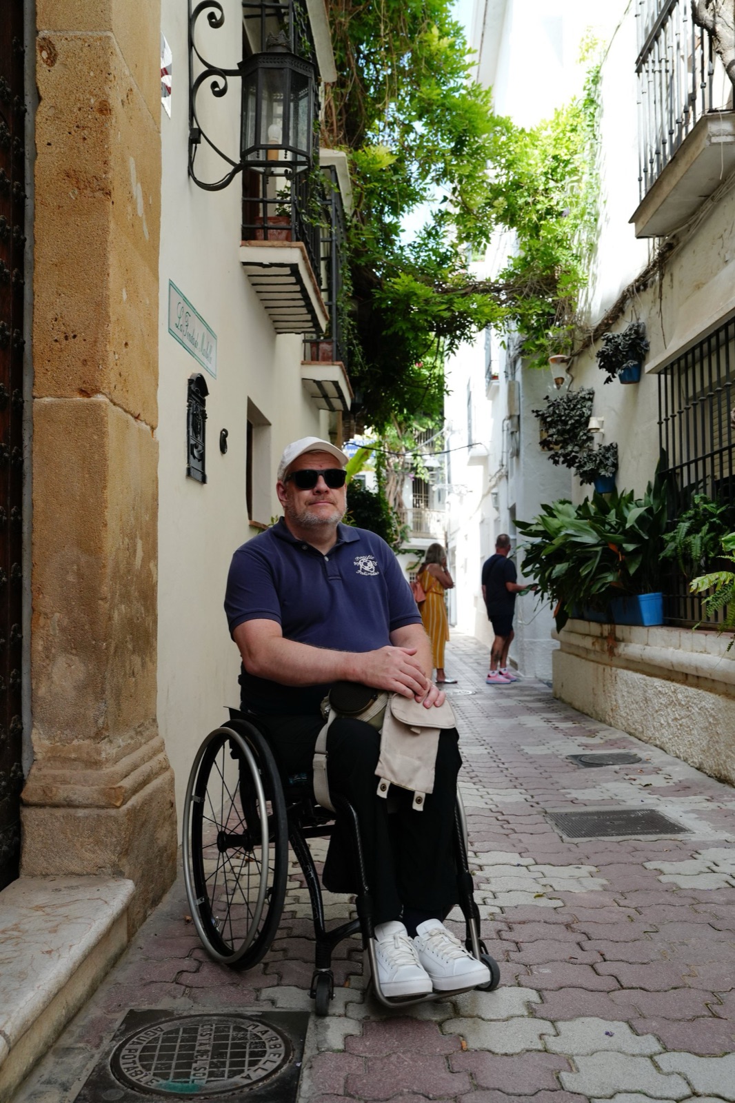 Per-Olof in his wheelchair in the middle of a smooth, level street in Marbella’s old town