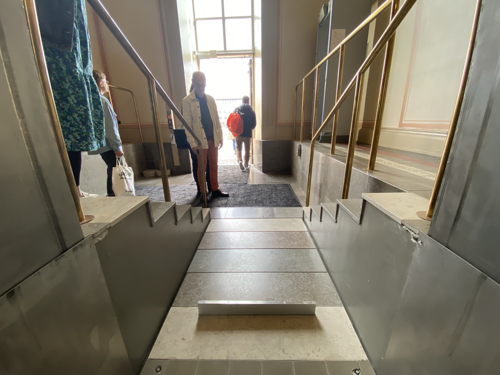 Staircase in a historic building whose steps fold into a flat lift platform