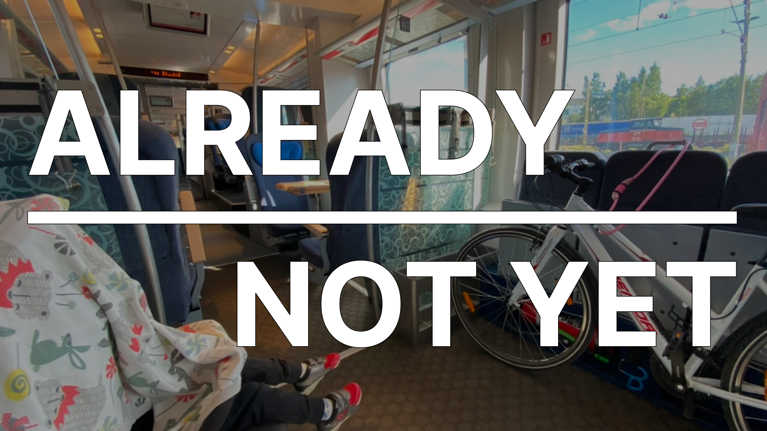 A train car with two contrasting compartments, creating a clear division between passengers. On top, there are two texts: “Already” and “Not Yet”.