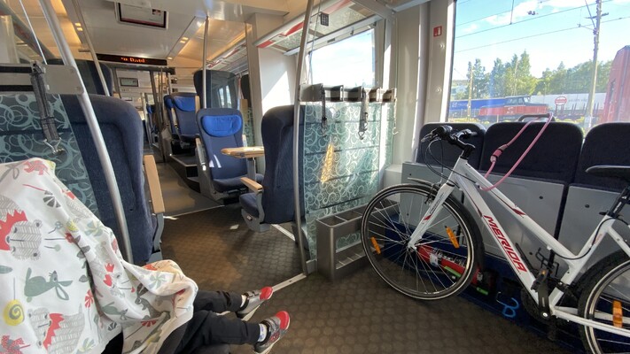 A train with a separate compartment for strollers, bikes, luggage, and persons using a wheelchair.
