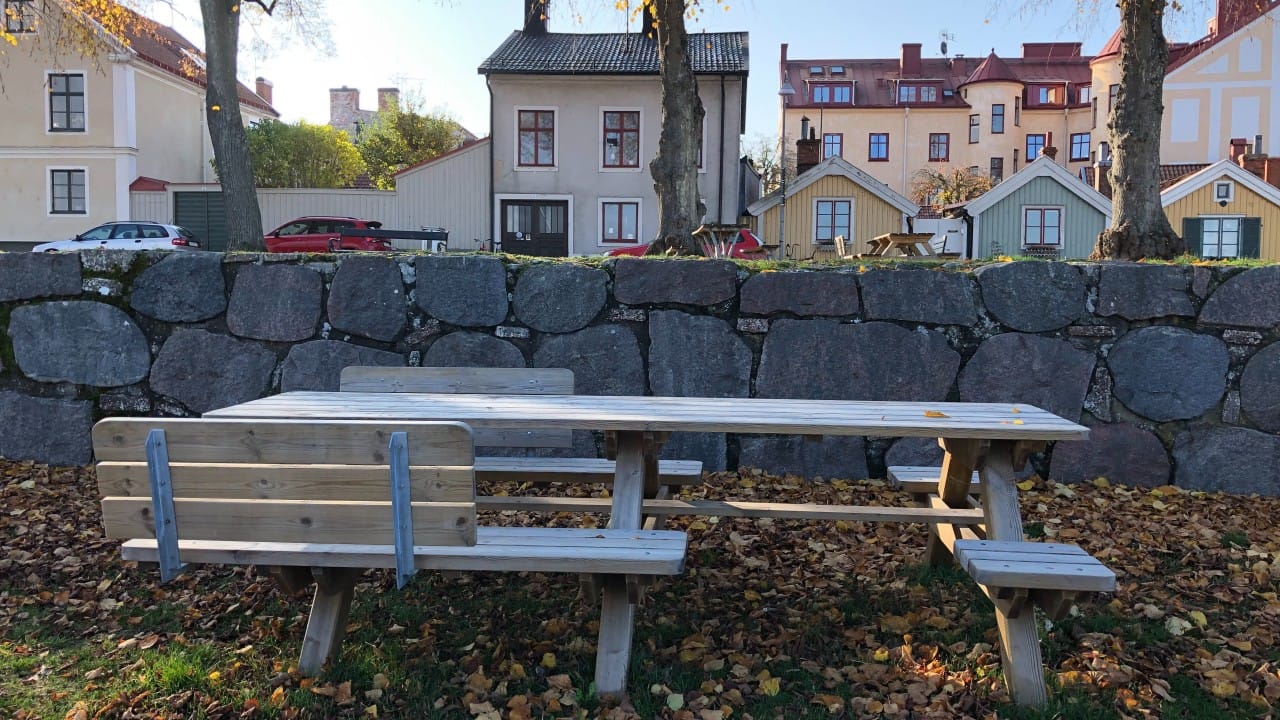 A picnic table with a variety of seating options, with and without backrest, armrest, and seating cutouts. This way, it meets human variation with seating variation. No sign, no symbol, no announcement, no requirements to meet.